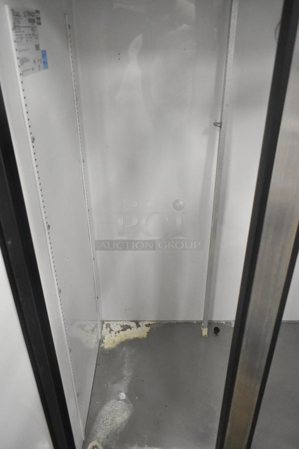 True T-35 Stainless Steel Commercial Cooler, interior view. Visible wear and label on side wall. 115 Volts, 1 Phase.