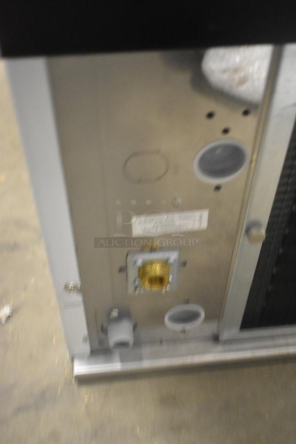 Manitowoc RFS0650A commercial ice head, stainless steel, 220V, 1 phase, brand new with scratches, brass connector visible.