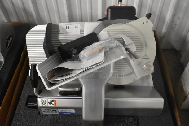 Brand new Globe S13 stainless steel 13" heavy-duty manual meat slicer with blade sharpener, 110 volts, 1 phase.