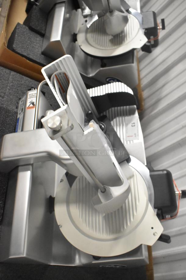 Brand new Globe S13 stainless steel commercial meat slicer with 13" blade and sharpener. 110V, 1 phase, heavy-duty.