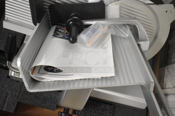 Brand new Globe S13 stainless steel 13" heavy-duty manual meat slicer with blade sharpener, 110V, 1 Phase.