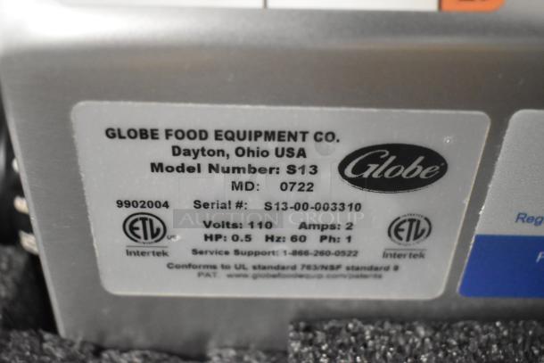 Globe S13 stainless steel meat slicer label showing model, serial number, voltage, and ETL certification. Brand new condition.