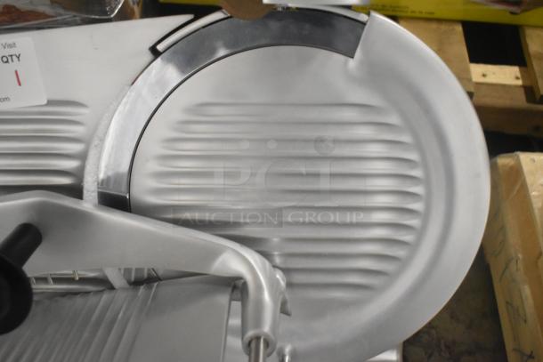 BRAND NEW Globe G12 stainless steel meat slicer, 13" blade, heavy-duty manual, with sharpener included; 115 Volts, 1 Phase.