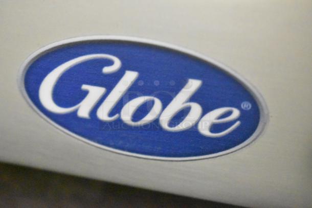 Brand new Globe G12 stainless steel commercial 13" meat slicer with blade sharpener, 115V, 1 phase.