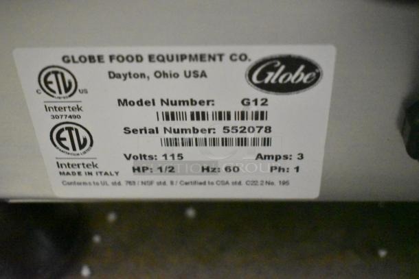 Label on Globe G12 meat slicer, showing model number, serial number, and electrical specifications: 115 volts, 1 phase.