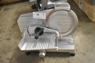 Brand new Globe C10 stainless steel commercial 13" meat slicer with blade sharpener, manual operation, 110V, 1 phase.