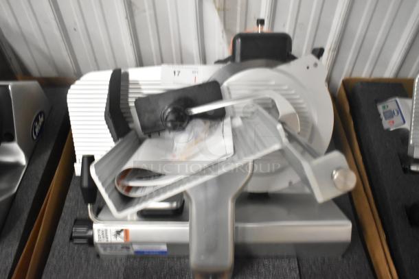 Brand new 2024 Globe S13-05 stainless steel meat slicer, 13" blade, manual with sharpener, 220V, 1 phase, heavy-duty.