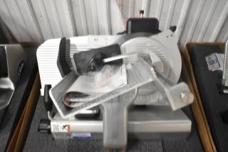 Brand new 2024 Globe S13-05 stainless steel meat slicer, 13" blade, manual with sharpener, 220V, 1 phase, heavy-duty.
