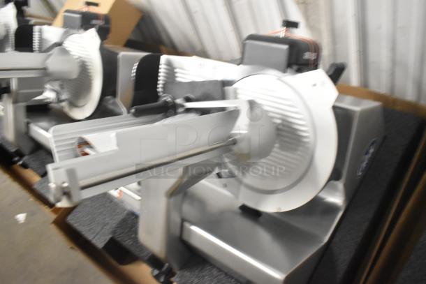 Brand new Globe S13-05 13" stainless steel countertop meat slicer, includes blade sharpener, 220V, 1 phase.