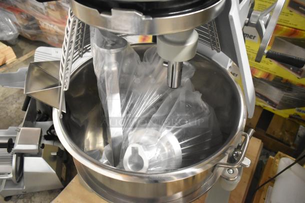 Brand new 2023 Globe SPC40 metal planetary dough mixer with mixing bowl, bowl guard, whisk, and pastry attachments.
