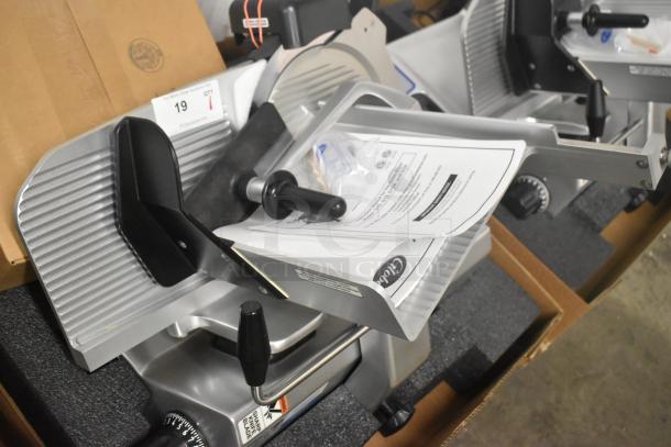 Brand new Globe SG13-84 stainless steel meat slicer, 13" blade, manual, with blade sharpener, in original packaging.