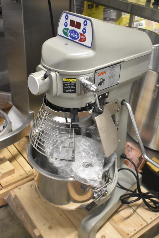 Brand new 2023 Globe SP20 20 Qt. planetary dough mixer with bowl guard. Features controls, caution labels. 110V, 1 phase.