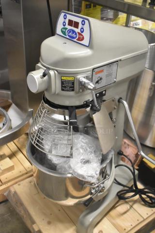Brand new 2023 Globe SP20 20 Qt. planetary dough mixer with bowl guard. Features controls, caution labels. 110V, 1 phase.
