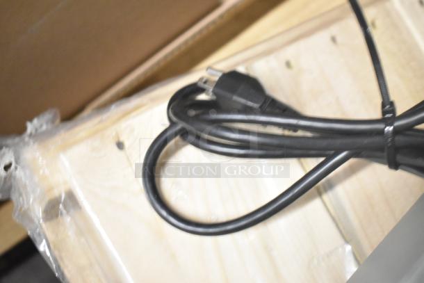 New Globe SP20 commercial dough mixer packaged with power cord, showing 110V plug. Features bowl guard.