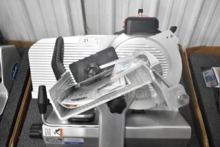 Brand new Globe S13A-51 stainless steel commercial 13" meat slicer with blade sharpener, 110V, 1 phase, in packaging.
