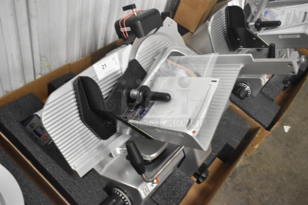 Brand new Globe S13A-51 13" stainless steel meat slicer with blade sharpener, manual operation, 110V, heavy-duty.