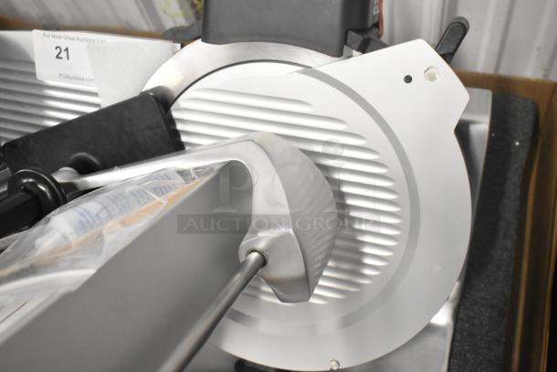 2022 Globe S13A-51 stainless steel commercial meat slicer, 13" blade, manual, includes blade sharpener, brand new condition.