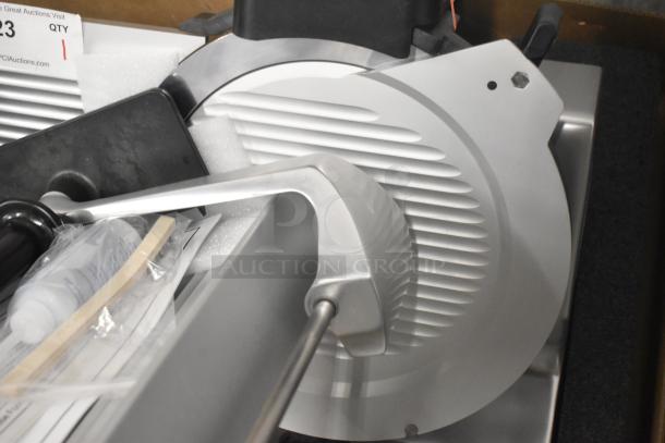 Brand new Globe S13A-24 meat slicer, stainless steel, 13" blade, manual, with sharpener, 110V, 1 phase, pristine condition.