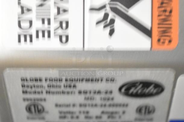 Globe S13A-24 stainless steel manual meat slicer label, indicating model and electrical specifications.