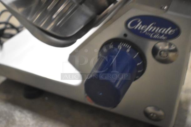 Brand new Globe GC512 stainless steel meat slicer with manual controls and built-in blade sharpener, 110V, 1 phase.