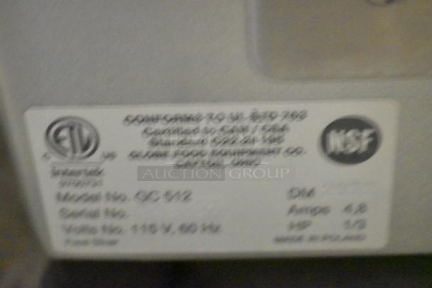 Globe GC512 stainless steel meat slicer tag, showing model, voltage (110V), phase details, NSF certification, and manufacturing info.