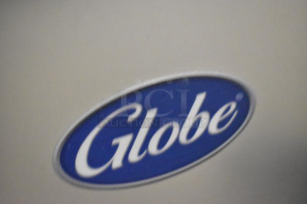 "Globe" logo on stainless steel manual meat slicer. Brand new, includes blade sharpener. 110 Volts, 1 Phase.