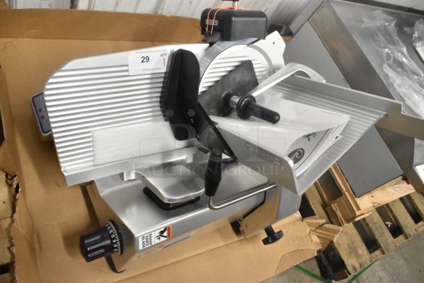 Brand new Globe SG13A stainless steel commercial 13" meat slicer with blade sharpener, 110V, 1 phase, automatic operation.