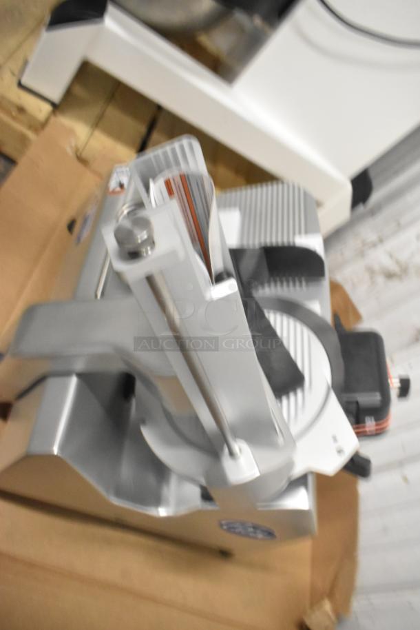 Brand new Globe SG13A stainless steel 13" automatic meat slicer. Features blade sharpener, 110V, 1 phase.