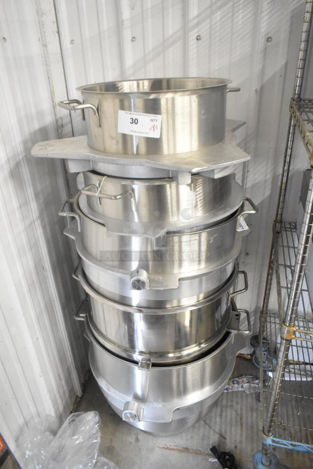 Stack of five brand new metal mixing bowls, including two AR80-75AM 80 quart and one RN100-75M 100 liter, gleaming finish.