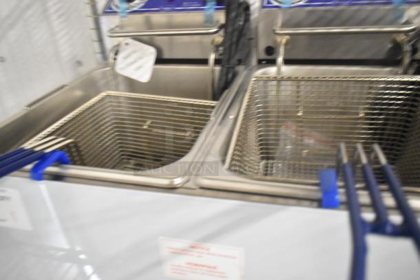Brand new Globe PF32E stainless steel commercial fryer with two metal fry baskets; electric, 208/240V, 1-phase.