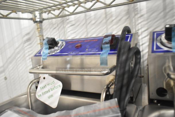 Brand new Globe PF32E stainless steel commercial electric fryer with 2 fry baskets, 208/240 volts, "Feet must be fitted" tag.