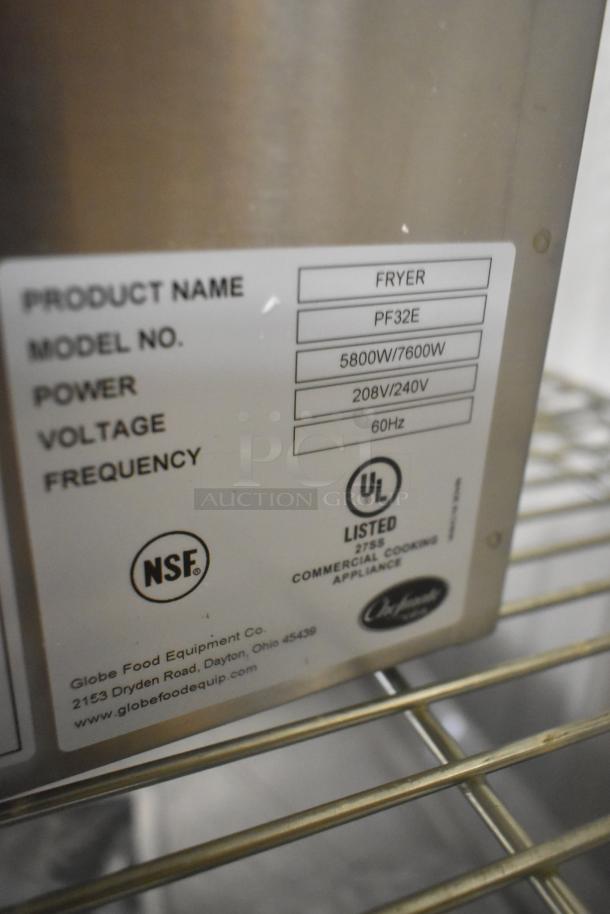 BRAND NEW! Globe PF32E stainless steel commercial countertop electric fryer with 2 metal fry baskets, 208/240V, 1 phase.