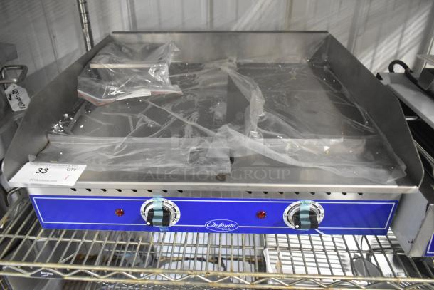 Brand new Globe GEG24 electric griddle; 24" stainless steel, thermostatic controls, commercial countertop model, protective plastic.