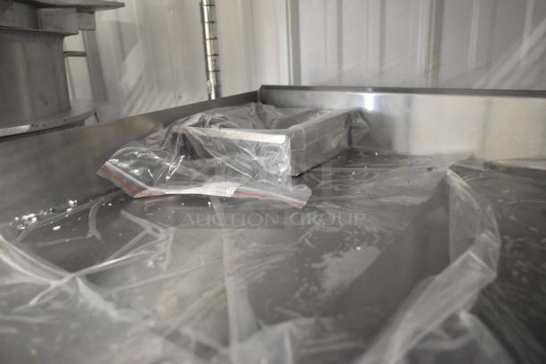 Brand new Globe GEG24 stainless steel 24" electric griddle with thermostatic controls, wrapped in protective plastic.