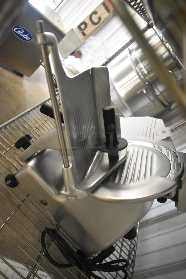 Brand new Globe G10 stainless steel commercial countertop meat slicer with blade sharpener, 120V, 1 Phase.