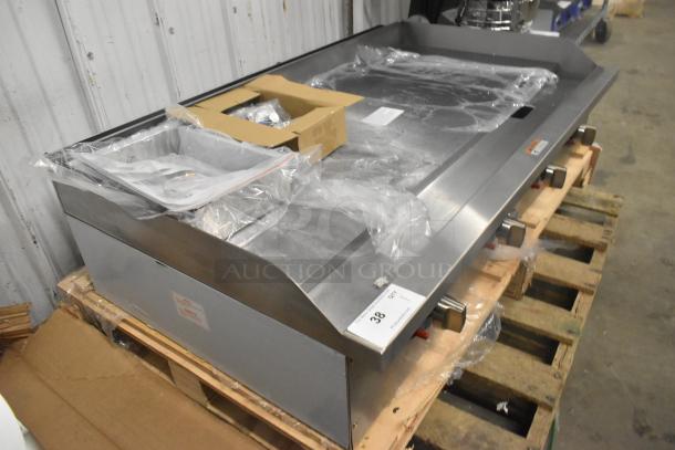 BRAND NEW Globe GG48TG 48" stainless steel natural gas griddle with thermostatic controls, 120,000 BTU, on pallet.