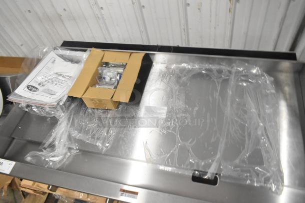Brand new Globe GG48TG 48" stainless steel griddle with thermostatic controls, 120,000 BTU, sealed in packaging.