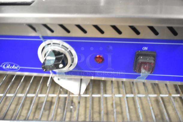 BRAND NEW 2024 Globe PG24E stainless steel countertop electric griddle, 208/240V, 1 phase. Features control knob and power switch.