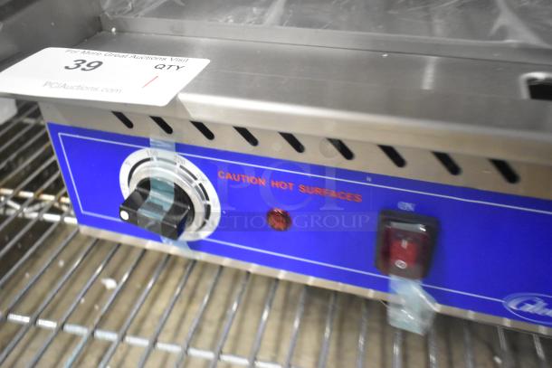 Brand new 2024 Globe PG24E stainless steel electric griddle. 208/240V, 1-phase, flat top, caution label visible.
