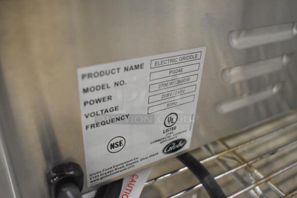 BRAND NEW! 2024 Globe PG24E stainless steel electric griddle. Label shows model PG24E, 2700/3600W, 208/240V, 60Hz.