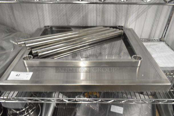 Brand new stainless steel tabletop with undershelf and legs, polished finish, includes assembly components, durable construction.