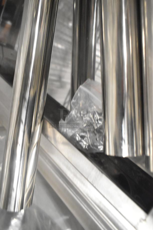 Brand new stainless steel tabletop parts, including legs and under shelf. Shiny finish, hardware included in bag.