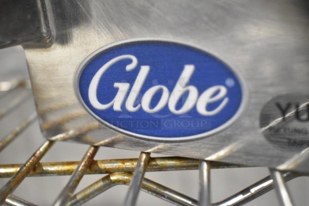 Brand new Globe metal commercial pelican head, no blade. Features a prominent Globe logo.