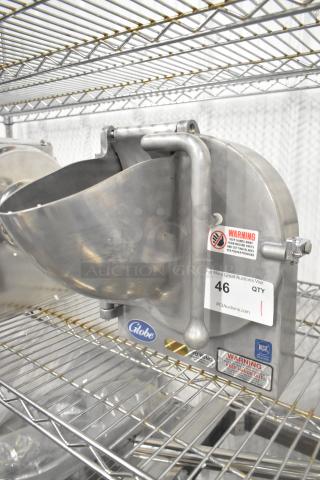 Brand new Globe metal commercial pelican head, no blade, on a metal rack. Includes warning label and Globe logo.