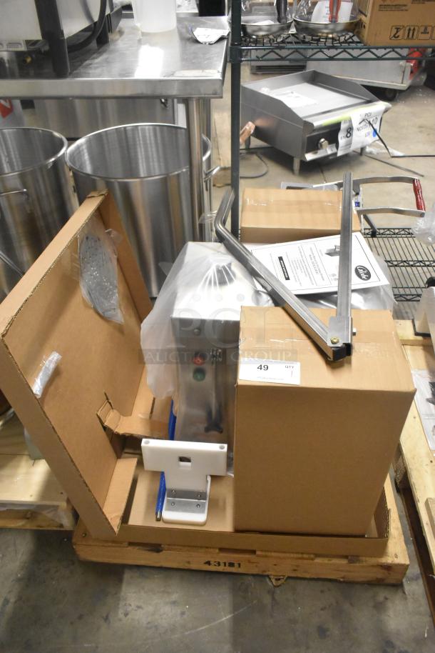 Brand new Globe GSCS2 electric cheese shredder, 65 lb./min capacity, in original packaging with manuals.