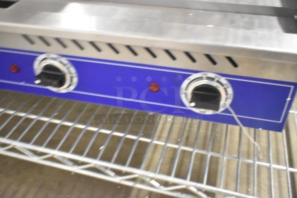 BRAND NEW Globe GEG36 stainless steel electric griddle, 208/240V, 1 phase. Features two control knobs and indicator lights.