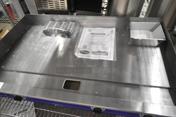 Brand new Globe GEG36 stainless steel electric griddle. Countertop design, 208/240V, 1 Phase. Includes manual.