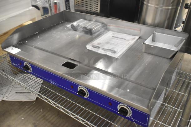 Brand new Globe GEG36 stainless steel commercial countertop electric griddle, 208/240 volts, 1 phase, on metal rack.