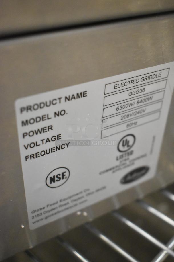 Brand new Globe GEG36 stainless steel electric griddle. Features 6300W/8400W power, 208/240V voltage, NSF certified.