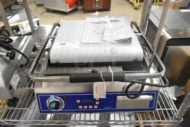 Brand new Globe C12 stainless steel commercial countertop panini press, model GPG14D, 120V, 1 phase, with control panel and handle.